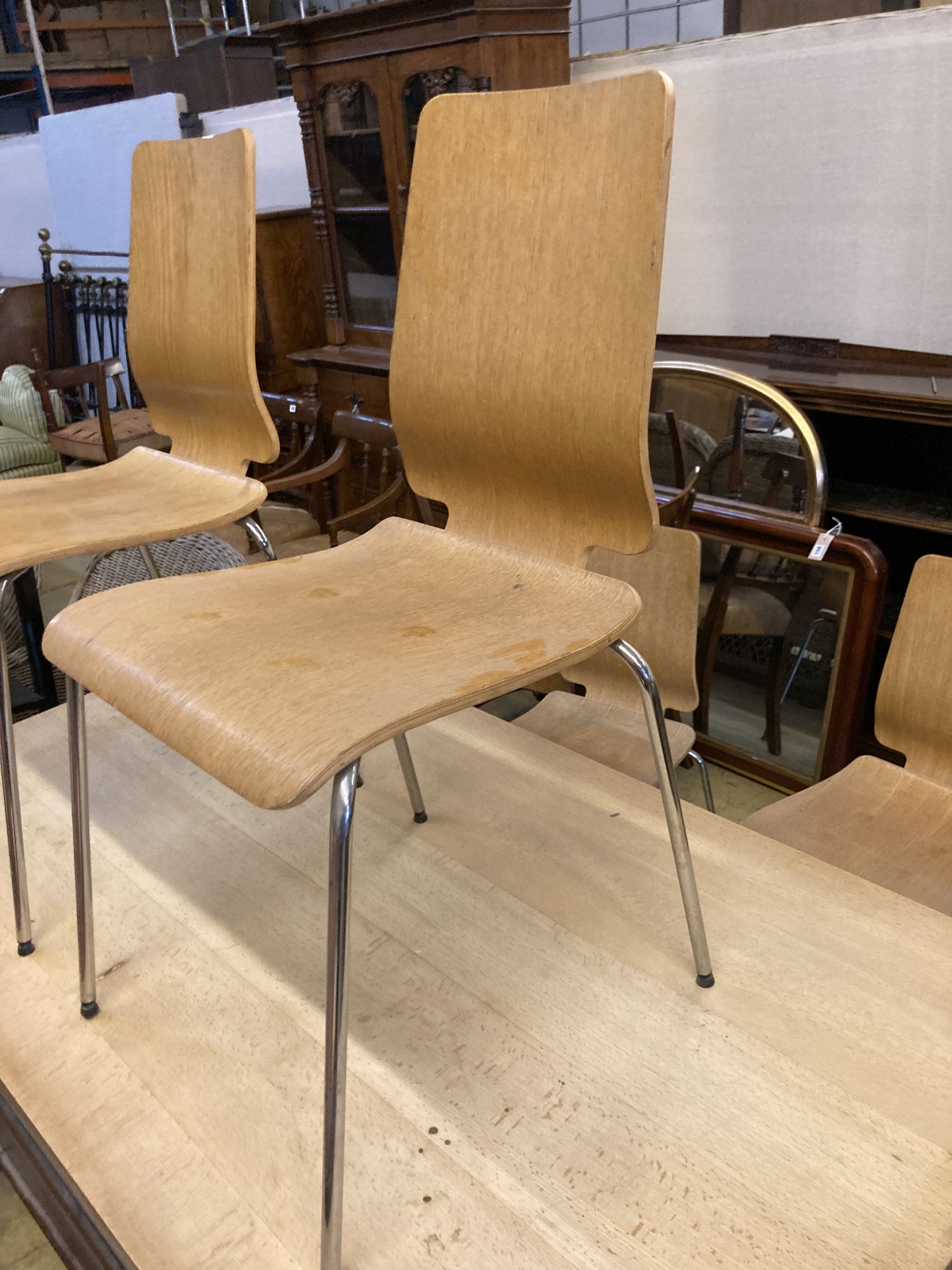A set of four mid century design bentwood and chrome dining chairs
